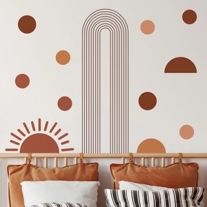 Macro detail of Boho geometric wall decals showing warm earth-tone sun and arch designs