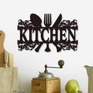 Modern black cutout Kitchen wall sign with fork and spoon decor on a white wall