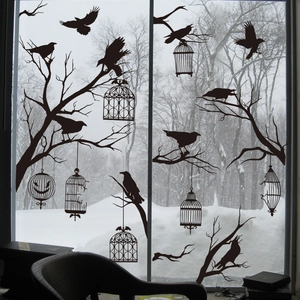 Halloween window decals featuring black crow silhouettes and gothic bird cages on glass