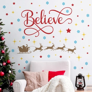 Christmas wall decal set featuring Believe text, Santa's sleigh, and snowflakes on a wall