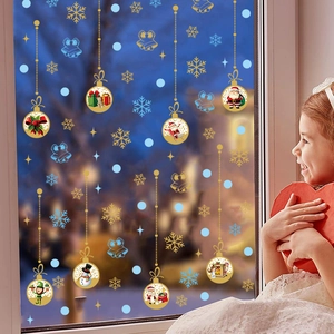 Golden Christmas window stickers set with snowflakes and ornaments on glass
