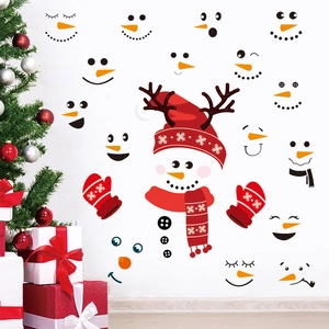 Christmas snowman face wall decals set with festive stickers on a white wall decor
