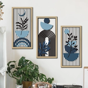 Set of 3 bohemian wood wall art featuring abstract leaves and geometric shapes in blue
