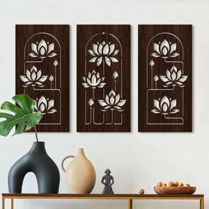 Three-piece laser-cut wooden lotus wall art set in a Zen style home interior