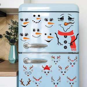 Detailed view of Christmas snowman and reindeer PVC decals on a light blue fridge