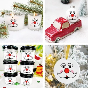 Close-up of waterproof Christmas Santa stickers applied to various glass and ceramic decor