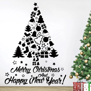 Detail of black PVC Christmas tree wall sticker with Merry Christmas text on white wall