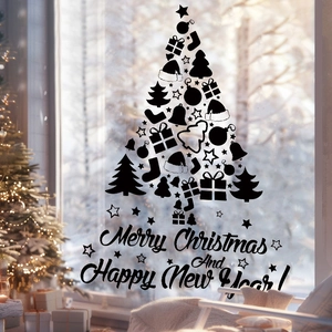 Detail of black Christmas tree wall sticker with Merry Christmas text on glass window