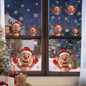 Weihnachtsfensteraufkleber mit Rentier-Motiv und goldenen Schneeflocken auf Glas