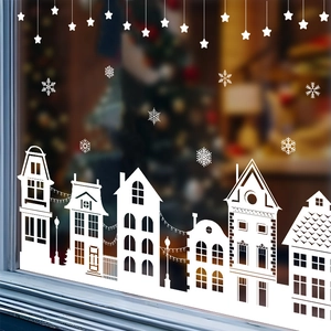 White Christmas window decals with snowy houses, snowflakes, and hanging stars decor