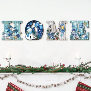 Close-up of HOME wooden letters with winter theme illustrations for wall decoration