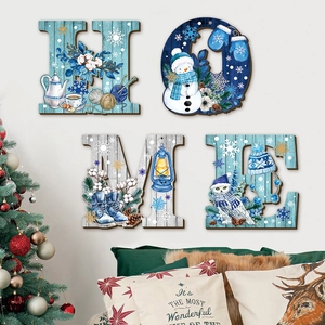 Winter-themed wooden HOME wall signs with snowman and owl illustrations for holiday decor