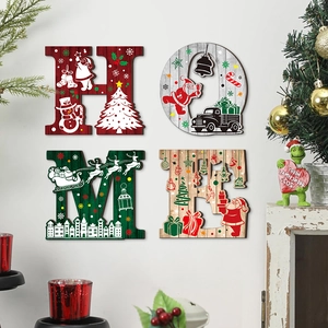 Detailed view of four wooden Christmas wall plaques spelling HOME with holiday illustrations