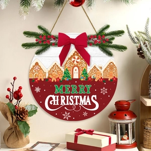 Round wooden Christmas welcome sign with red bow and gingerbread house for door decor