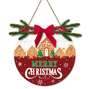 Merry Christmas round wooden door sign with a red velvet bow and gingerbread design