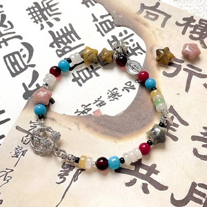 Star-shaped natural stone beads bracelet with silver cross and religious medal charms