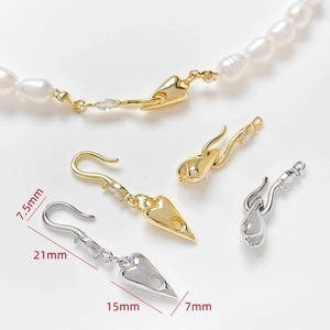 Close-up of heart-shaped 14k gold plated clasp with cubic zirconia for jewelry making