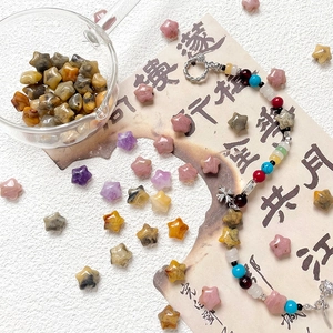 Close-up of colorful star-shaped natural stone beads for DIY jewelry making and crafts
