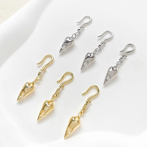 Detailed view of 14k gold-plated and silver heart ear hooks with cubic zirconia accents