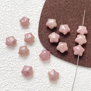 Macro shot of faceted pink natural stone star beads for DIY jewelry making and crafts