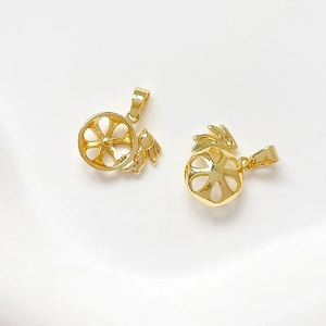 Detail showing two hollow gold-plated rabbit wheel charms for DIY jewelry making