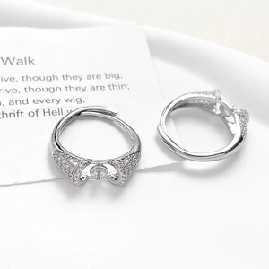 Close-up of adjustable silver-plated ring bases with cubic zirconia stones for DIY pearl jewelry