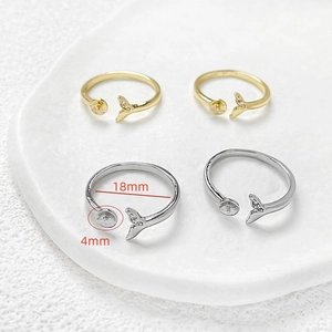 Macro shot of 14k gold-plated mermaid tail adjustable rings with 4mm pearl tray settings