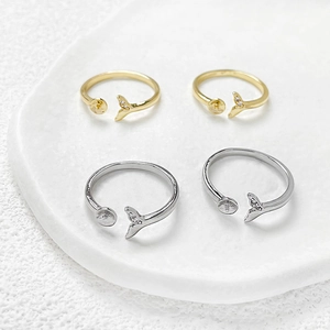 Detailed view of 14k gold-plated mermaid tail ring bases for DIY pearl mounting