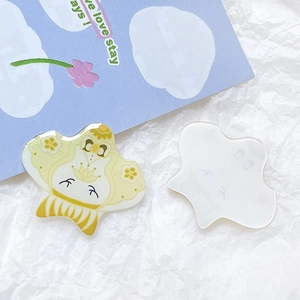 Detail view of acrylic charm featuring a cute cartoon character in a yellow kimono