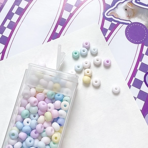 Macro detail of mixed matte macaron glass seed beads for DIY jewelry making and bracelets