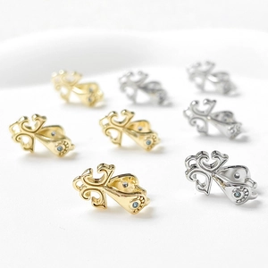 Detailed view of 18k gold plated filigree pendant clips with blue zircon stones