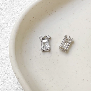 Macro view of rectangular clear zircon pendants with 14k gold plated silver finish