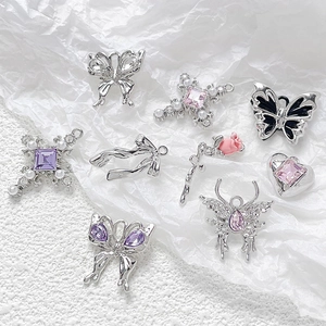 DIY Y2K jewelry charms set featuring silver butterflies, crosses and purple gemstones