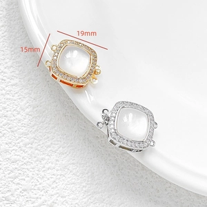 Close-up of 14k gold plated jewelry connectors with mother of pearl and micro-pave crystals