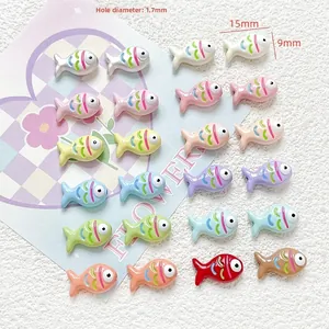 Close-up showing colorful 15x9mm fish-shaped resin beads with 1.7mm hole for DIY jewelry