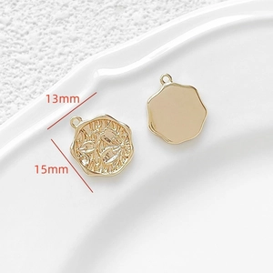 Detail of 18k gold plated Little Prince pendant showing embossed floral texture and size specs