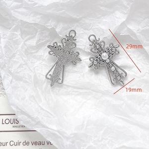 Detail of a vintage baroque cross pendant with pearls and rhinestones measuring 29mm x 19mm