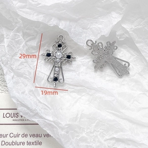 Detail of gothic silver cross pendant with black crystals and pearls, size 29mm x 19mm