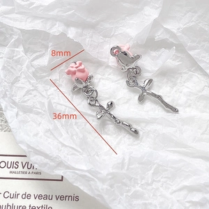 Macro shot of 36mm pink rose charms with silver stems and 8mm flower detail