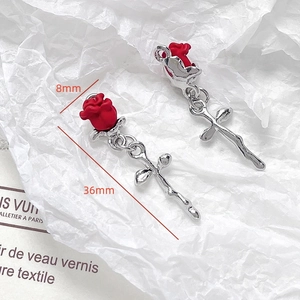 Macro detail of red rose drop earrings with dimensions 8mm diameter and 36mm length