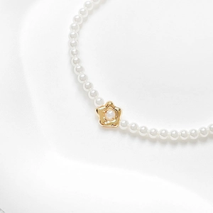 18k gold plated irregular pearl necklace with a delicate five-petal floral pendant
