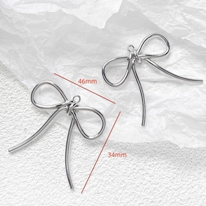 Silver bow pendant dimensions showing 46mm width and 34mm height for DIY jewelry
