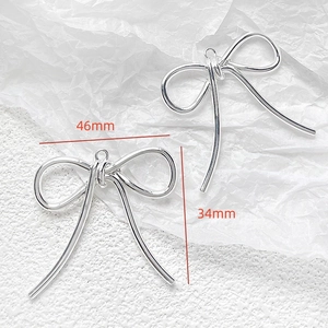 Silver bow pendant DIY jewelry component with polished finish and 46mm width dimensions