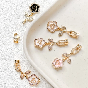 Detailed view of 18k gold plated camellia pearl clasps with cubic zirconia for DIY jewelry