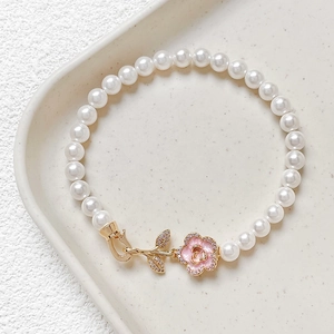 18k gold plated pearl bracelet with pink enamel camellia flower and zircon leaf clasp
