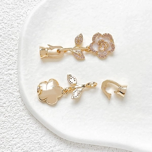 Detail of 18k gold plated camellia clasp with pink zircons for DIY jewelry making