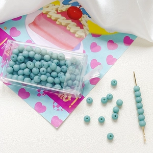 Detail of 4mm frosted light green glass beads with clear storage box for DIY jewelry making