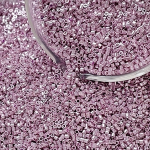 Macro view of light purple metallic glass cylinder beads for DIY jewelry making