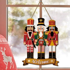 Detail of wooden Christmas nutcracker welcome sign with festive soldiers and rope hanger