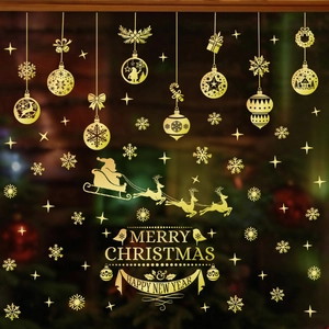 Golden Merry Christmas vinyl window decals featuring reindeer, bells, and snowflakes